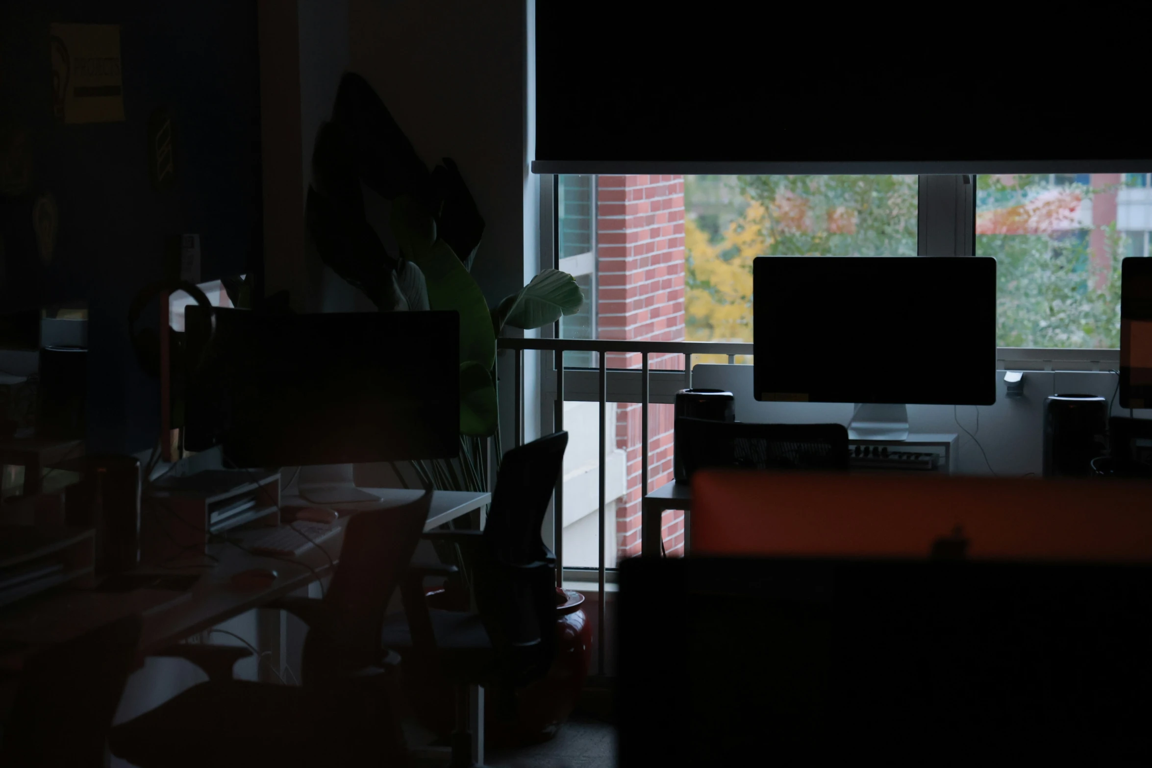 some office work desks with two computer monitors