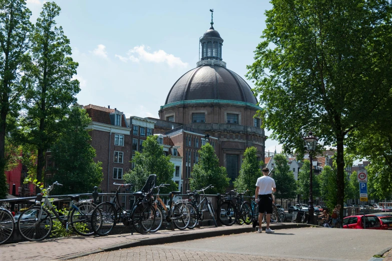 some bikes are parked near the building and trees