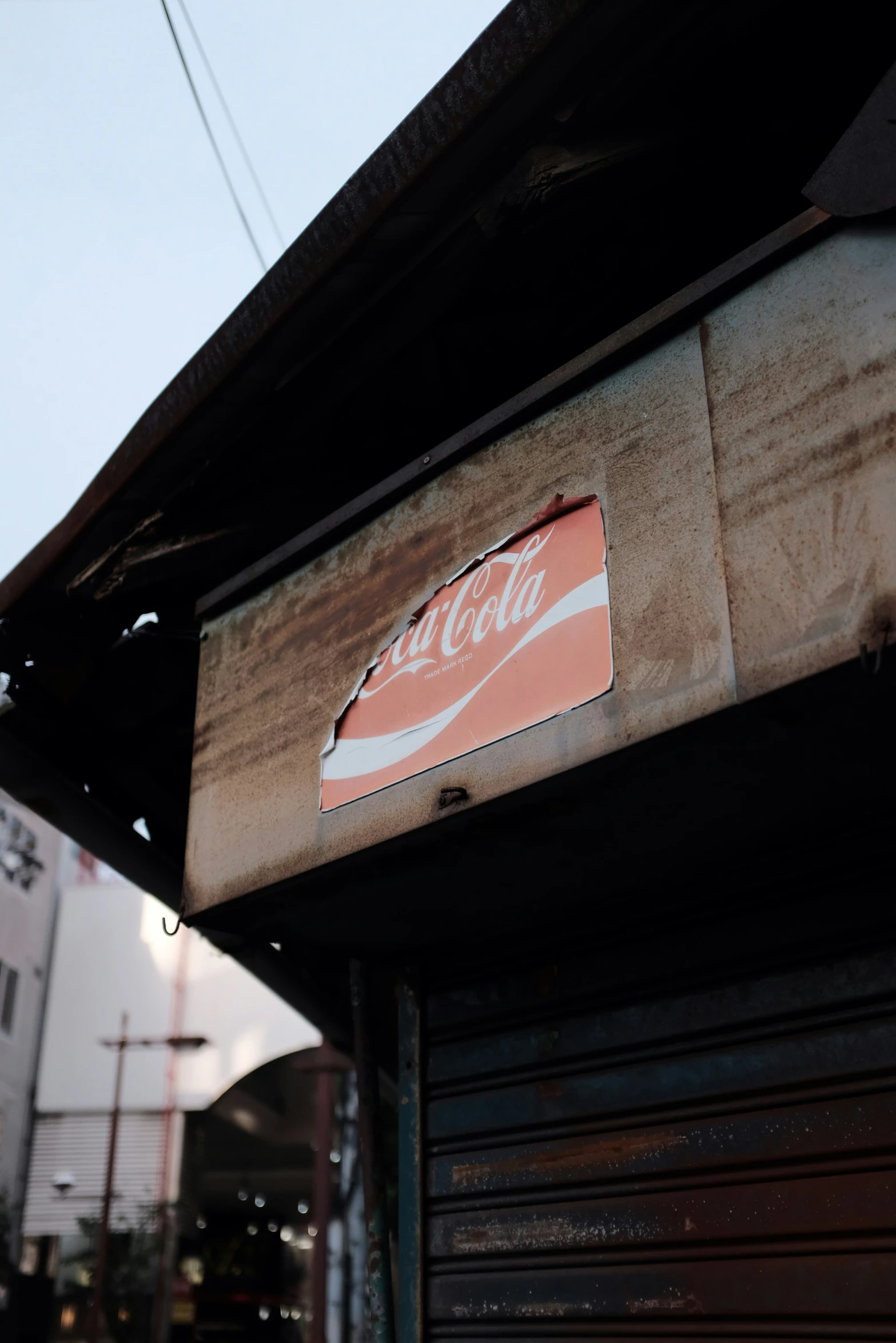 the back side of a closed coca cola sign