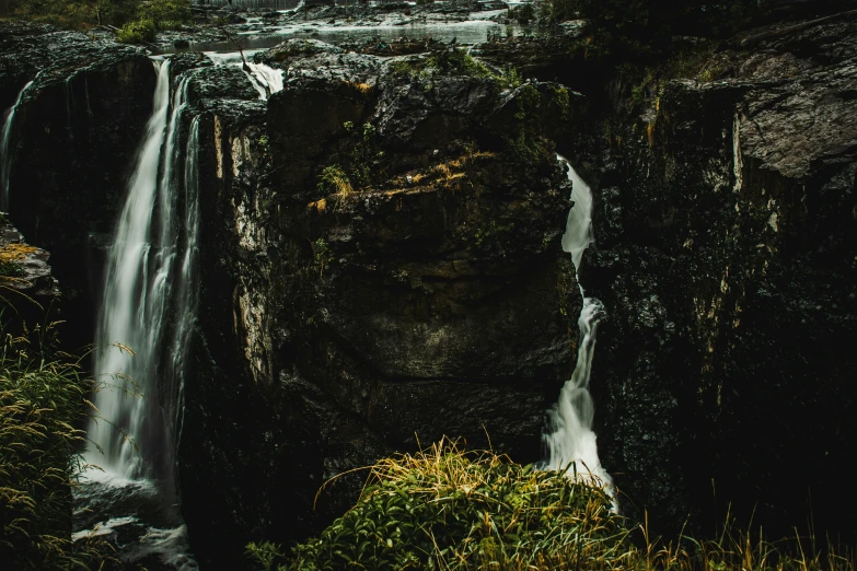 waterfall that runs down to the ground below it