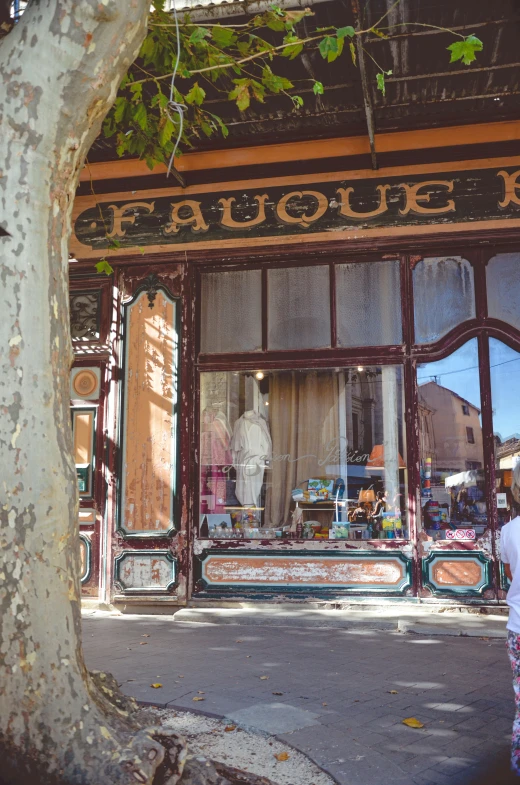 a shopfront with the front entrance painted chipped paint