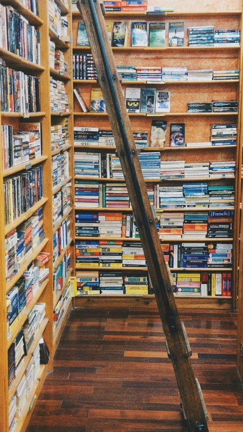 a room with lots of books lined up against a wall