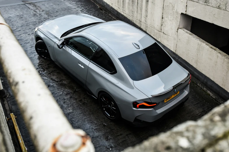 this is an aerial view of a gray sports car