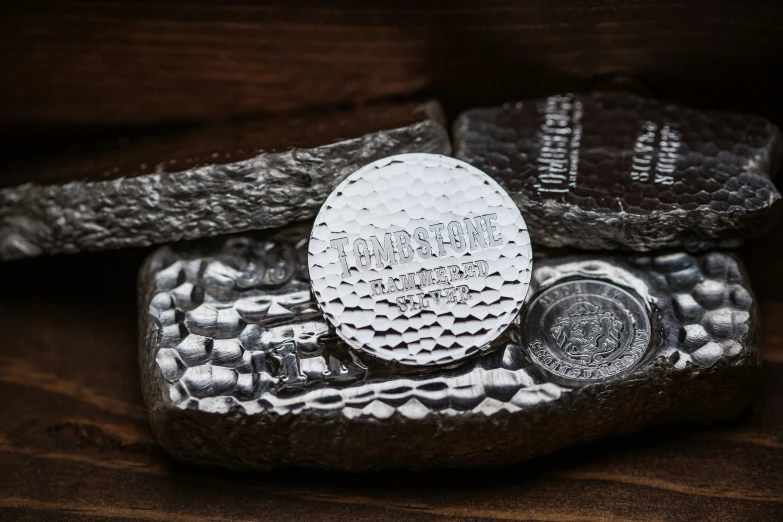 a coin with a silver background and texture