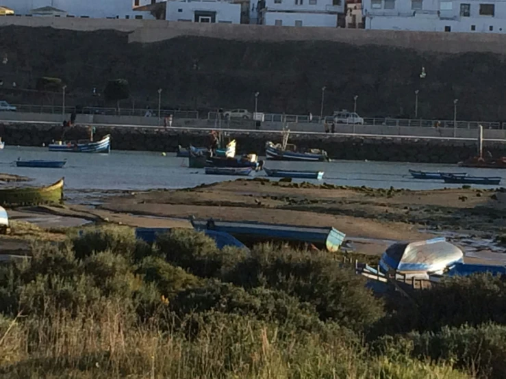 there are many small boats docked in the harbor