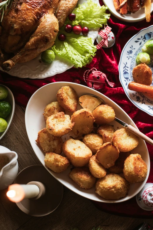 a feast of meat, vegetables and a baked chicken