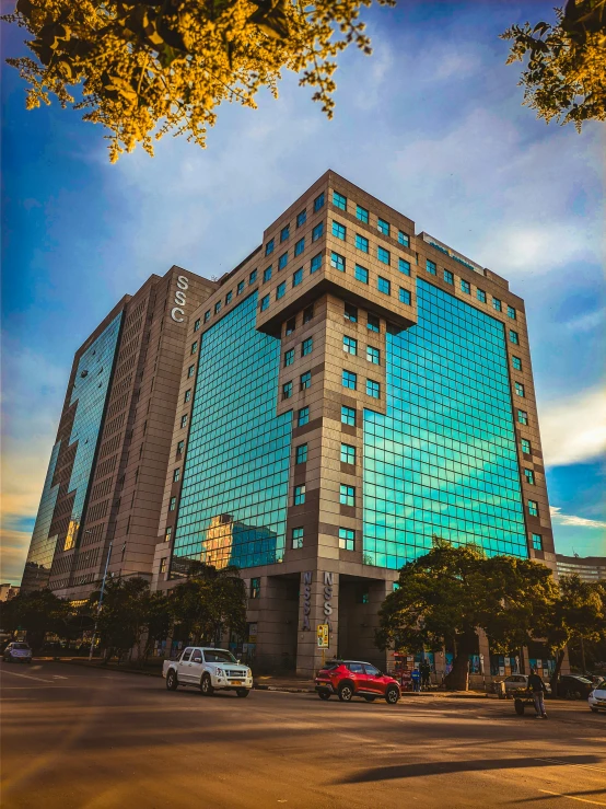 a large building has a blue and grey top