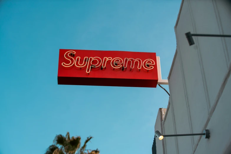 a large red sign with the word supreme on it