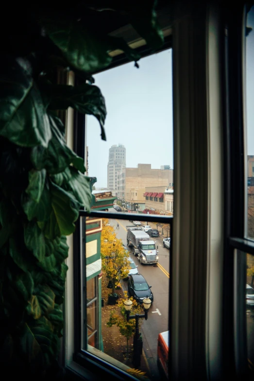 the view from a restaurant window with city buildings in the background