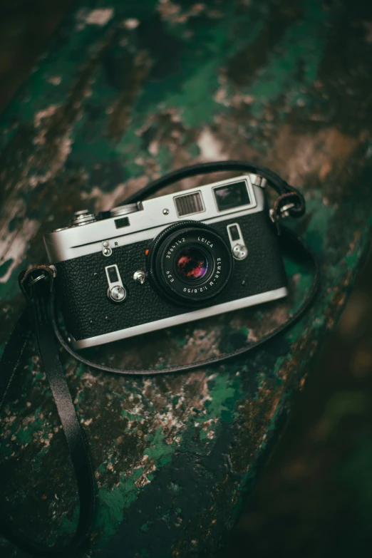 a camera sitting on top of a wooden table