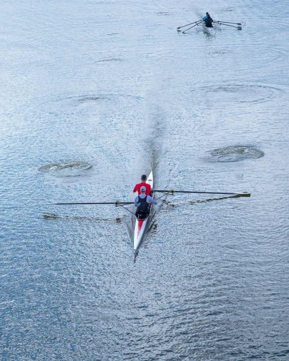 there is a man rowing a boat on the water