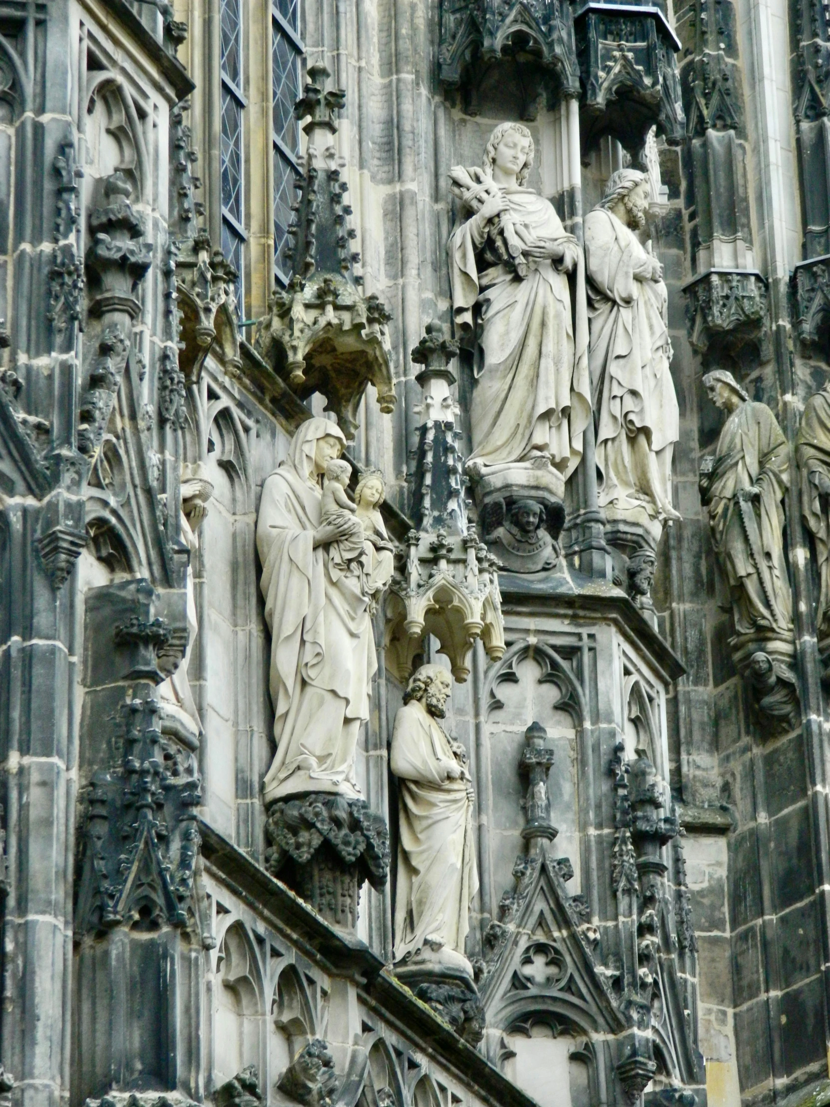 sculptures adorn the facade of an old castle