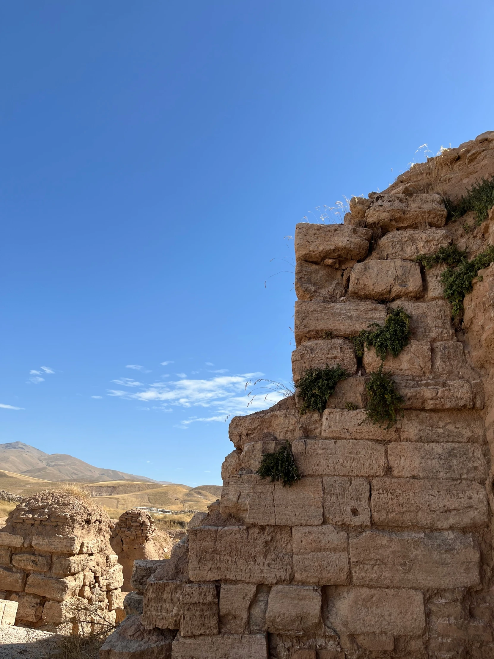 some stone buildings in a mountain area