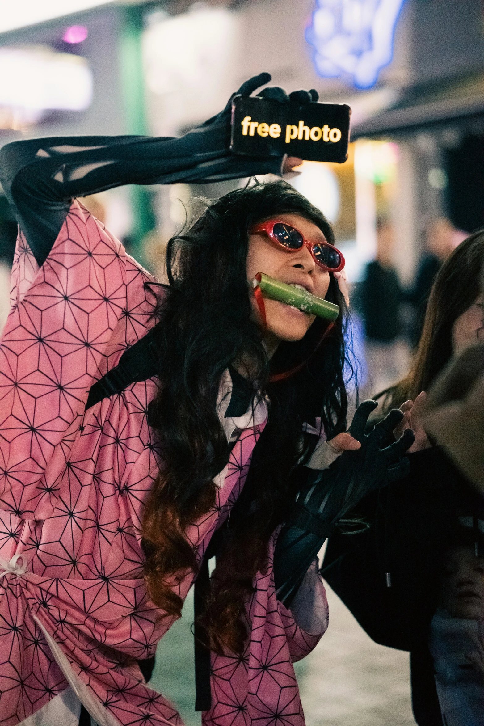 a young woman with makeup painted on her lips holding a bike