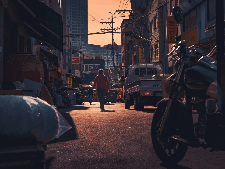 a street filled with lots of cars and motorcycles