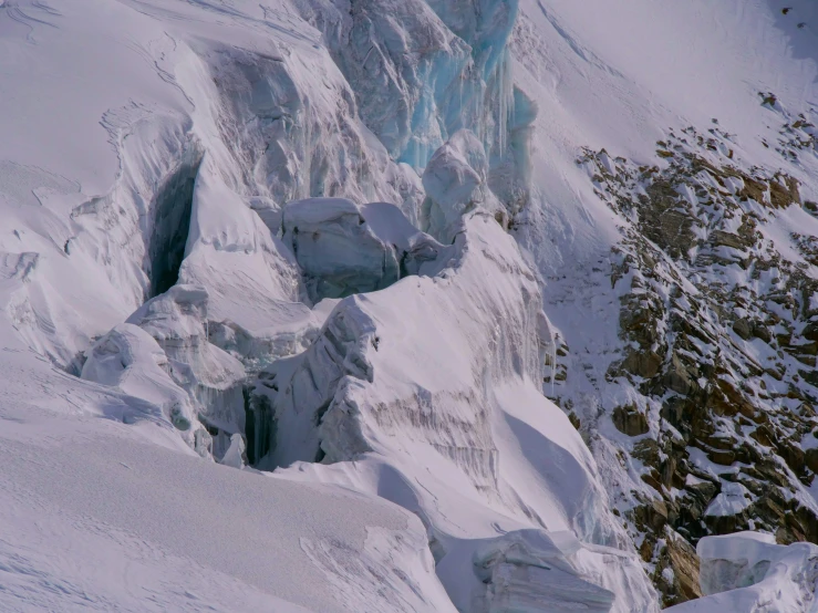 this is a snow covered mountain side with some trees