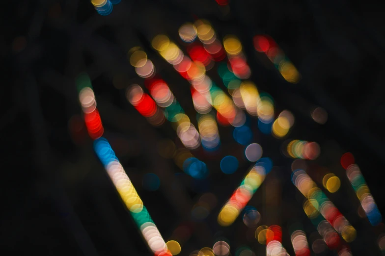 blurry images of multi - colored lights shine together