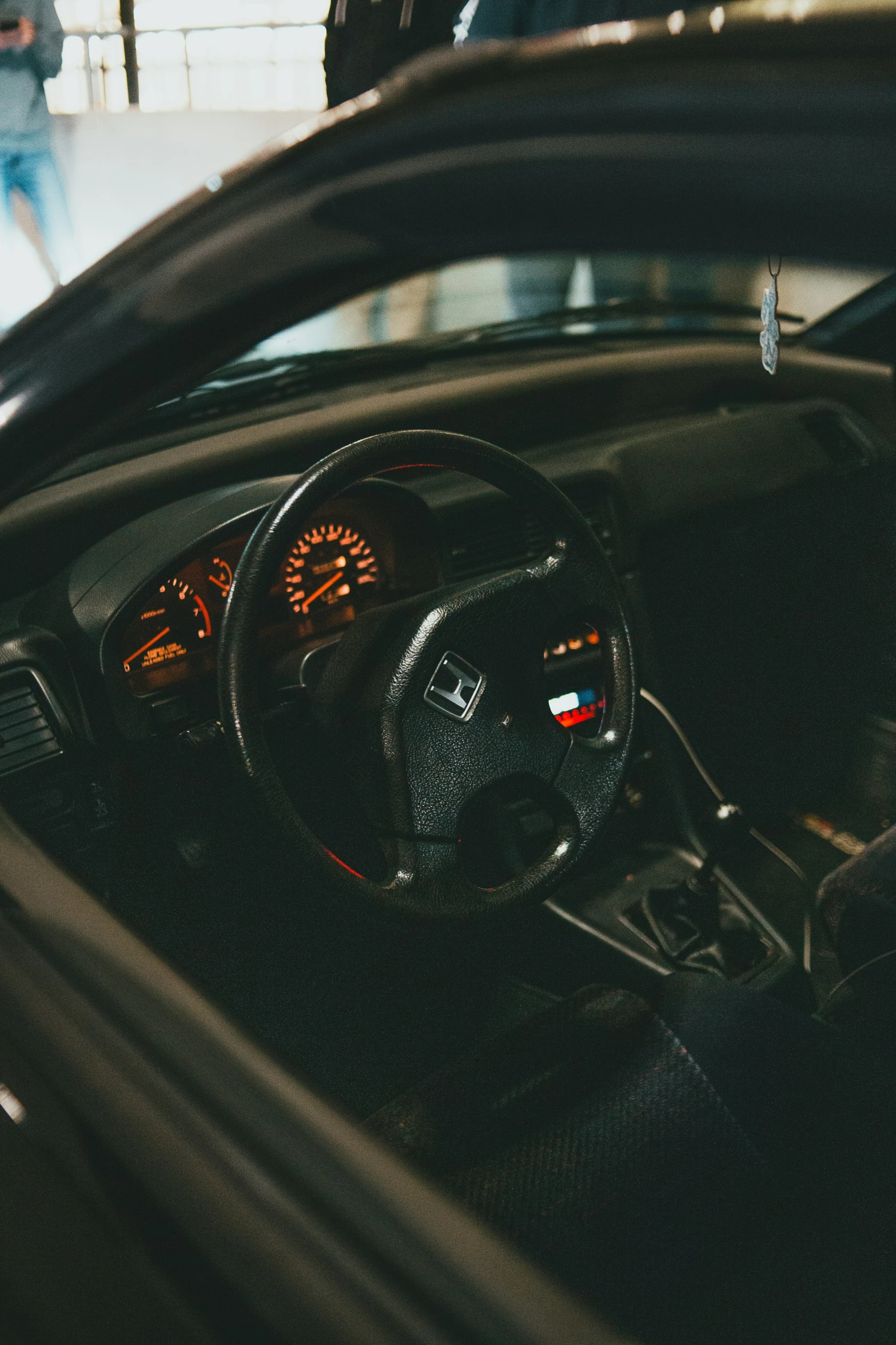 an dashboard and car at a busy station