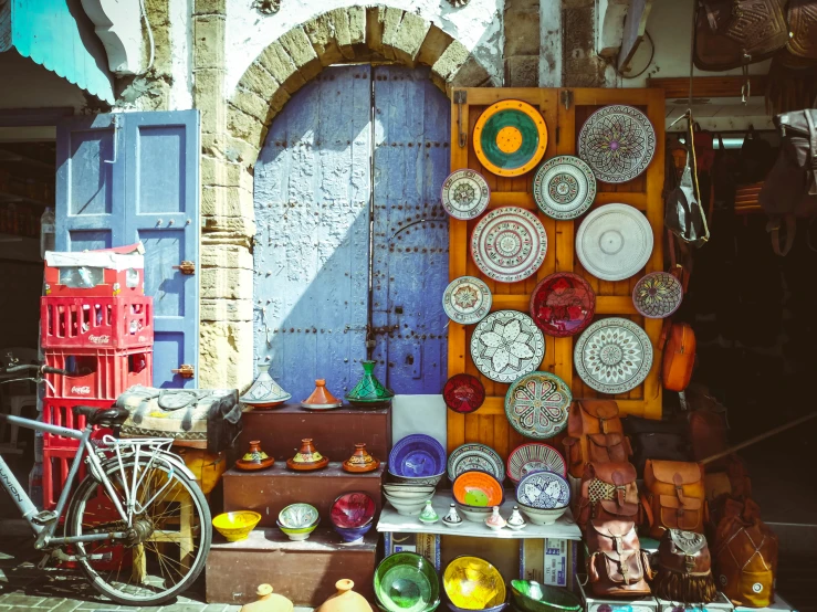 an outside display filled with bowls and plates