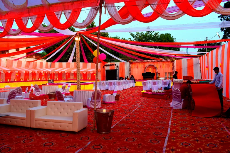 rows of chairs in front of a decorated area