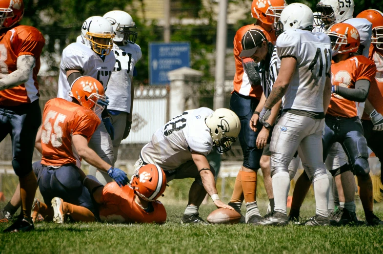 a group of people on a field playing football