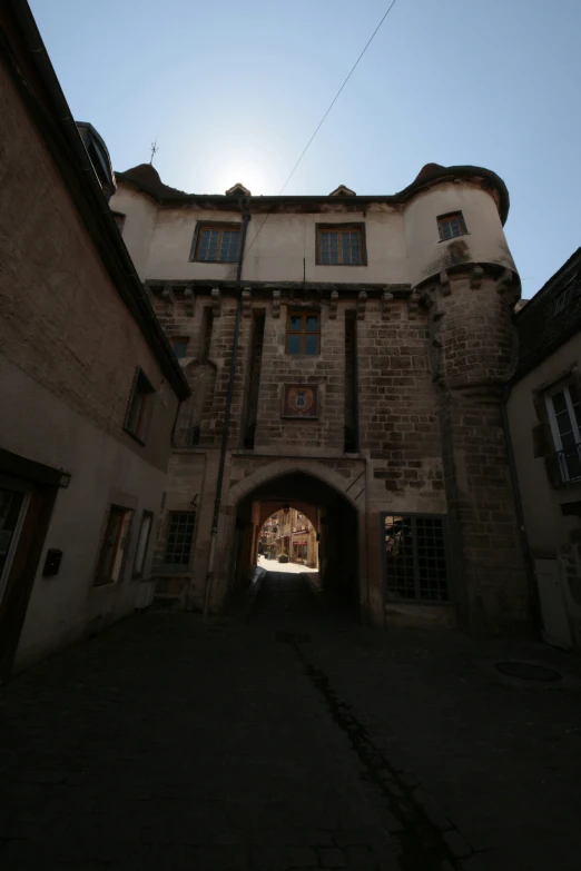 an old stone building with some windows on the top