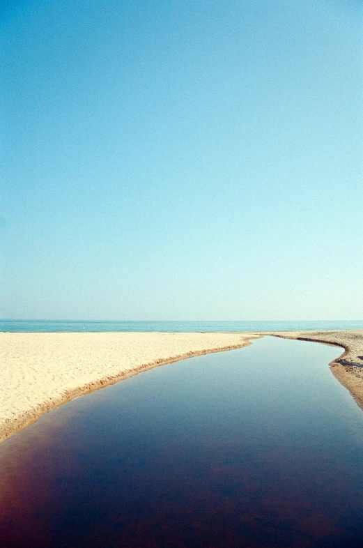 a small boat sitting in a large body of water