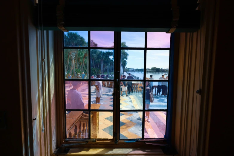 the sun shining through a glass window in a house