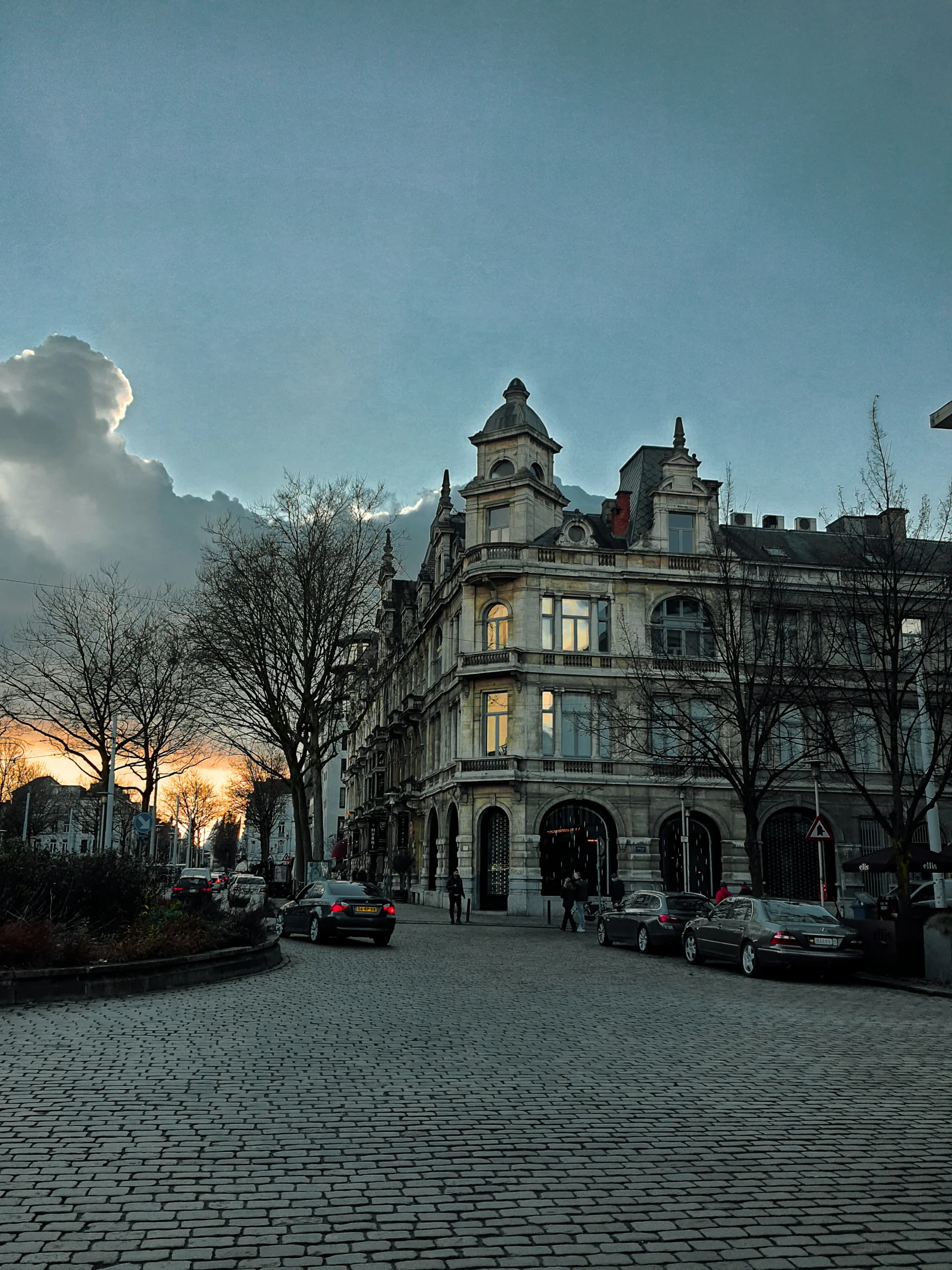 the view of a fancy old building at dusk