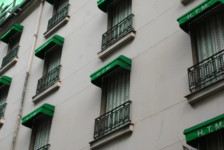 green and white building that has some windows