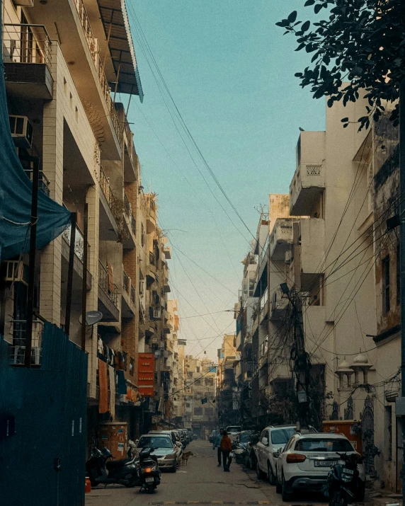 a street filled with parked cars and buildings