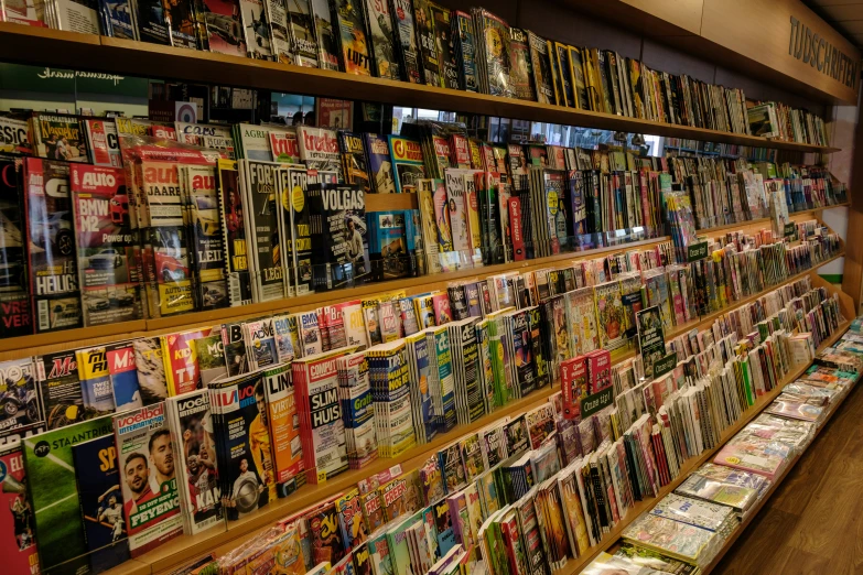 rows and rows of magazines on display in shop