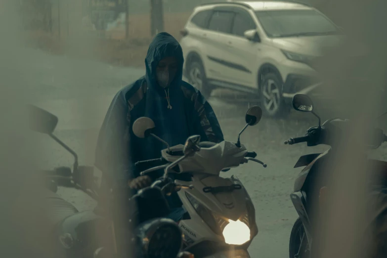 a man standing next to a parked motorcycle