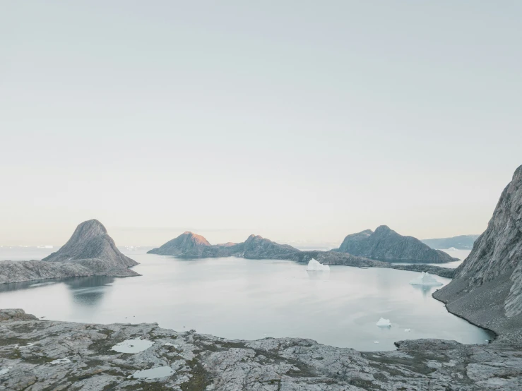 a large body of water with a bunch of rocks on the side of it