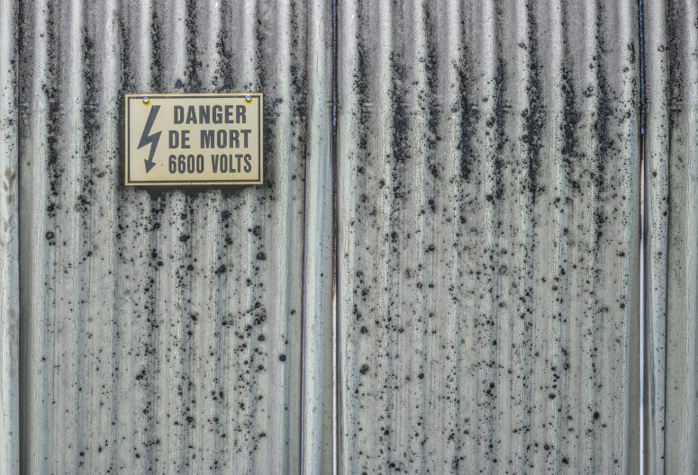 a sign on the side of an industrial building