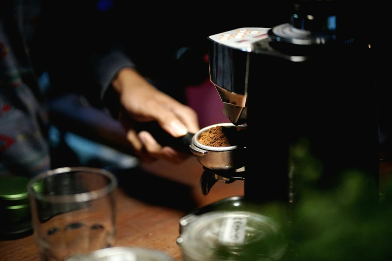 a close - up of someone stirring soing in a metal container