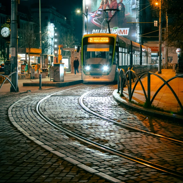 a city bus is turning on a cobblestone street