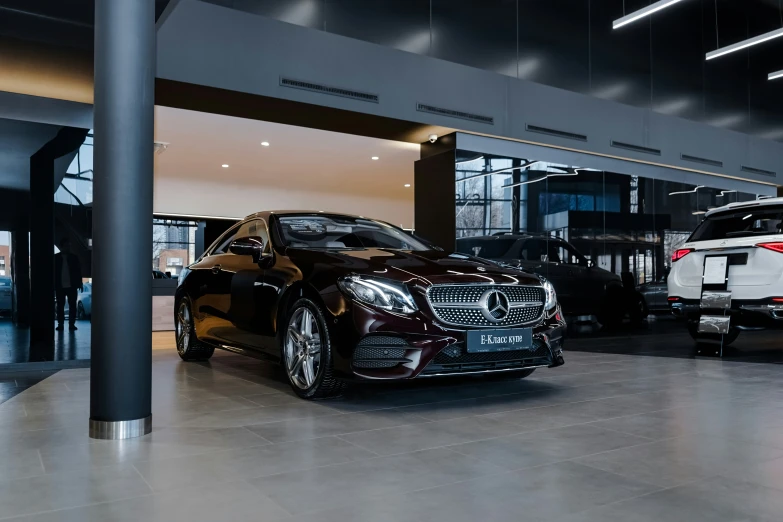 two cars are parked in an underground garage