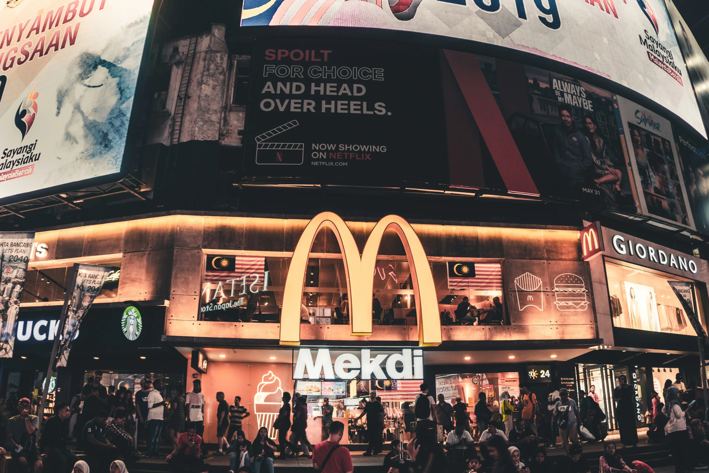 an ad for mcdonald's in the city at night