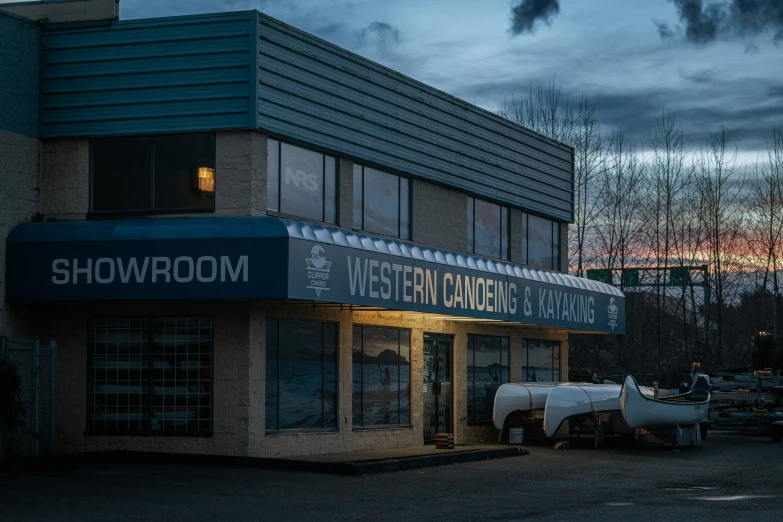 the front of a building that has a truck parked in front