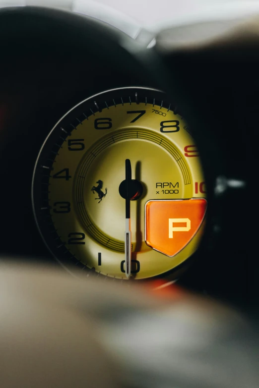 a close up of an analog clock sitting on a desk