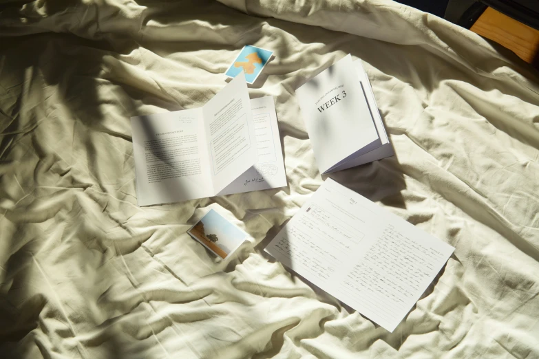 two open books on a white sheet