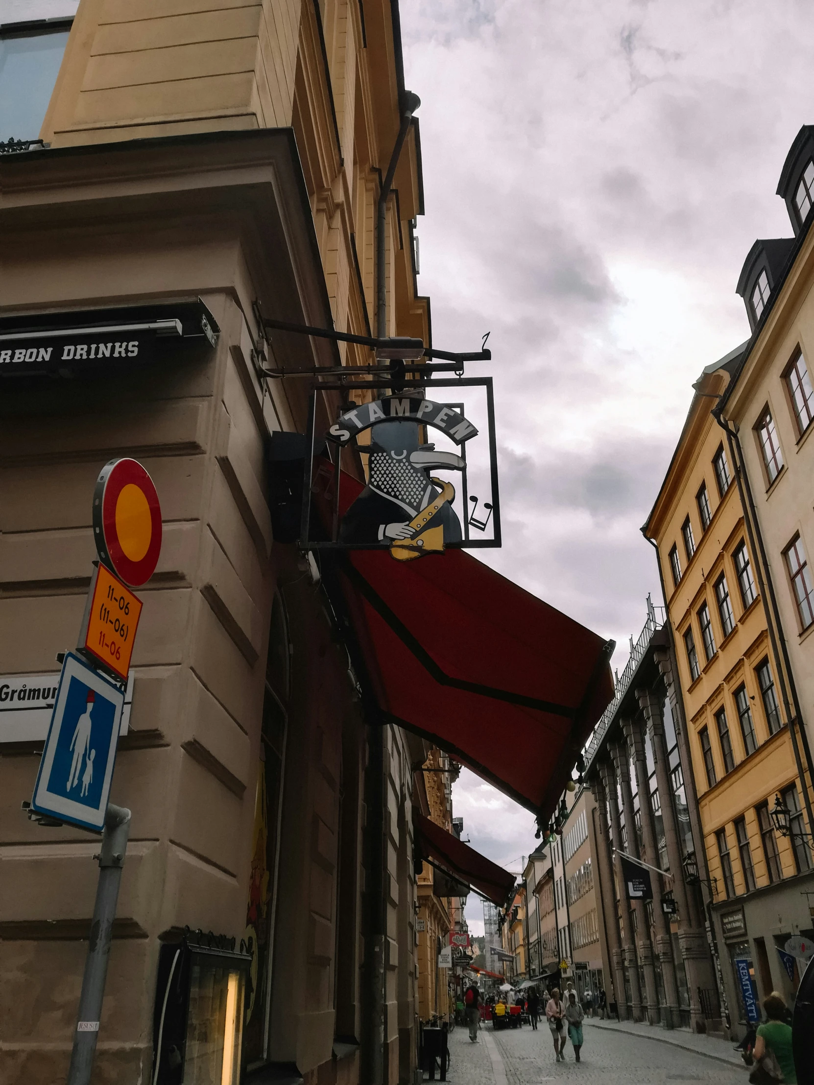 buildings on either side of the street with signs on them