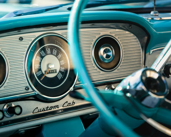 a car dashboard with ons and clock showing