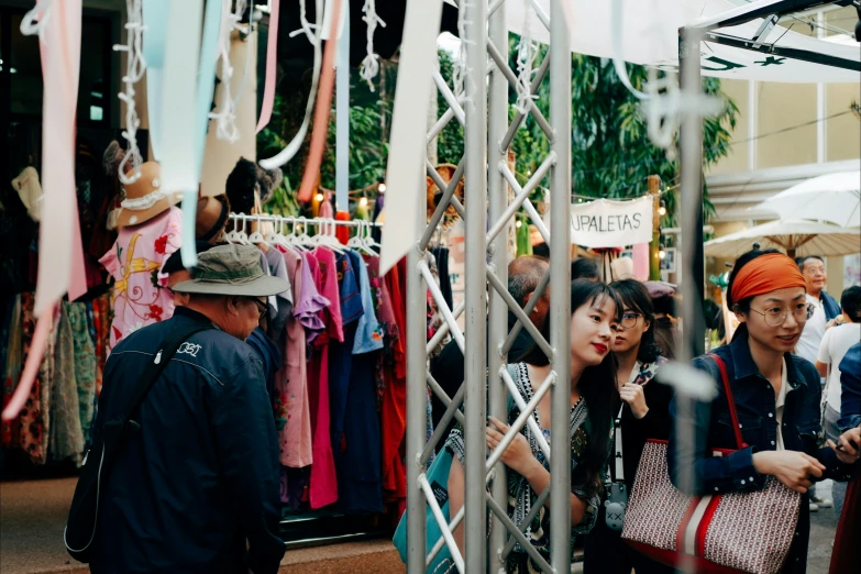 a group of young people standing around a store