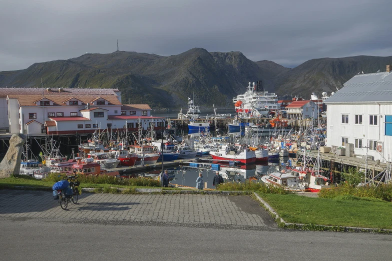 boats are parked in the marina in a small village