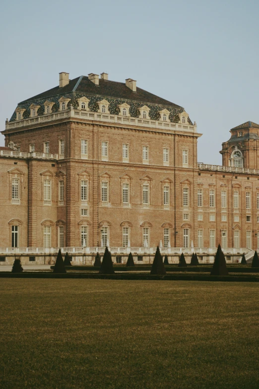 a large stone building is shown in an image with a sky background