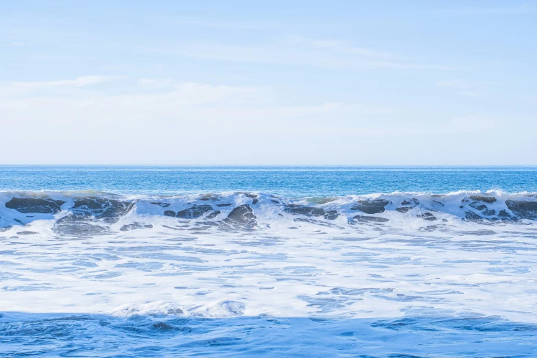 surfer with a black board riding in the waves