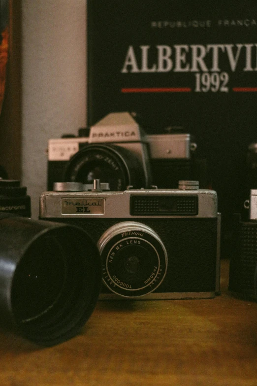 an old fashioned camera is shown on a table