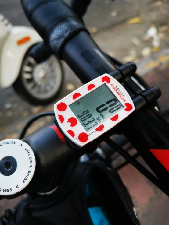 a digital bike speed meter sitting on the handle